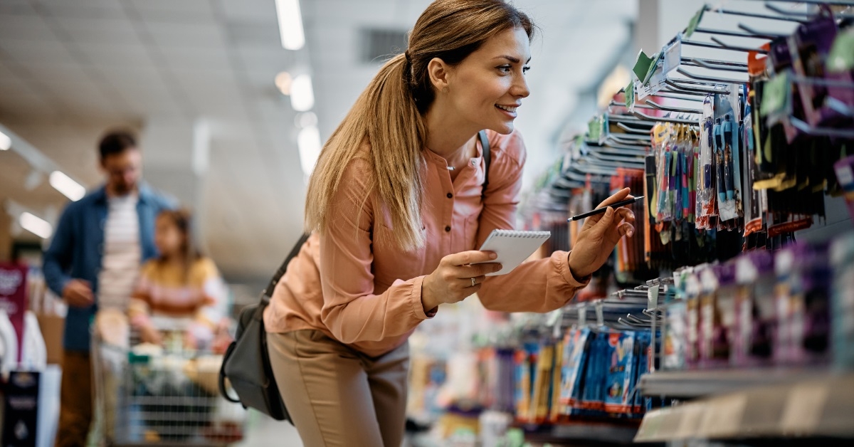 mother buying school supplies for kids