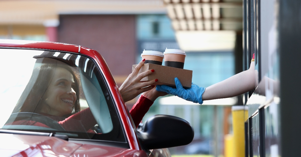 woman picking up coffee in Mcdrive
