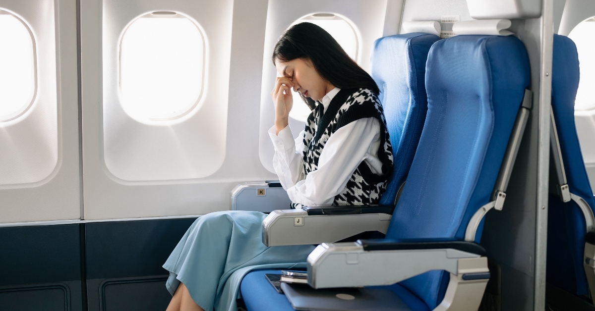 A woman frustrated on a plane