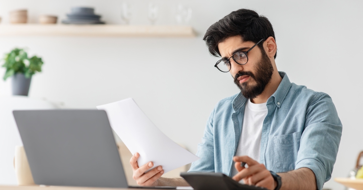 man calculating taxes