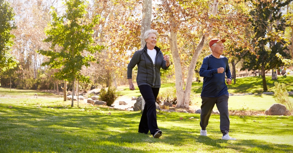 senior couple power walking