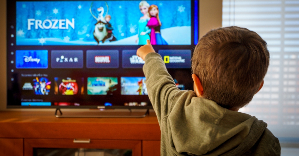 little boy watching the new Disney