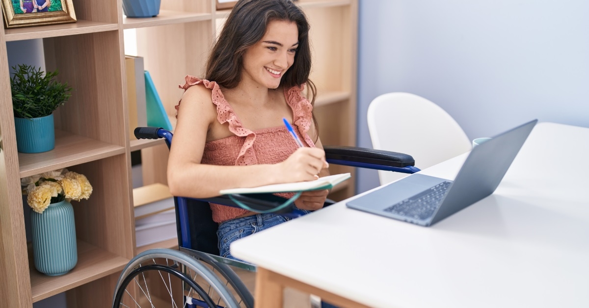 woman with disability studying from home