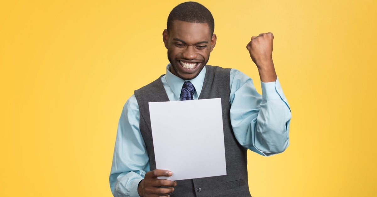 cheerful african american man holding document