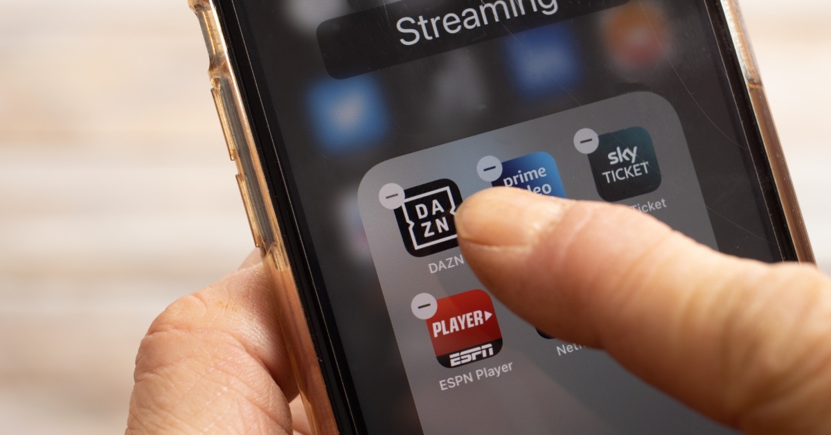 finger removing streaming apps from homescreen