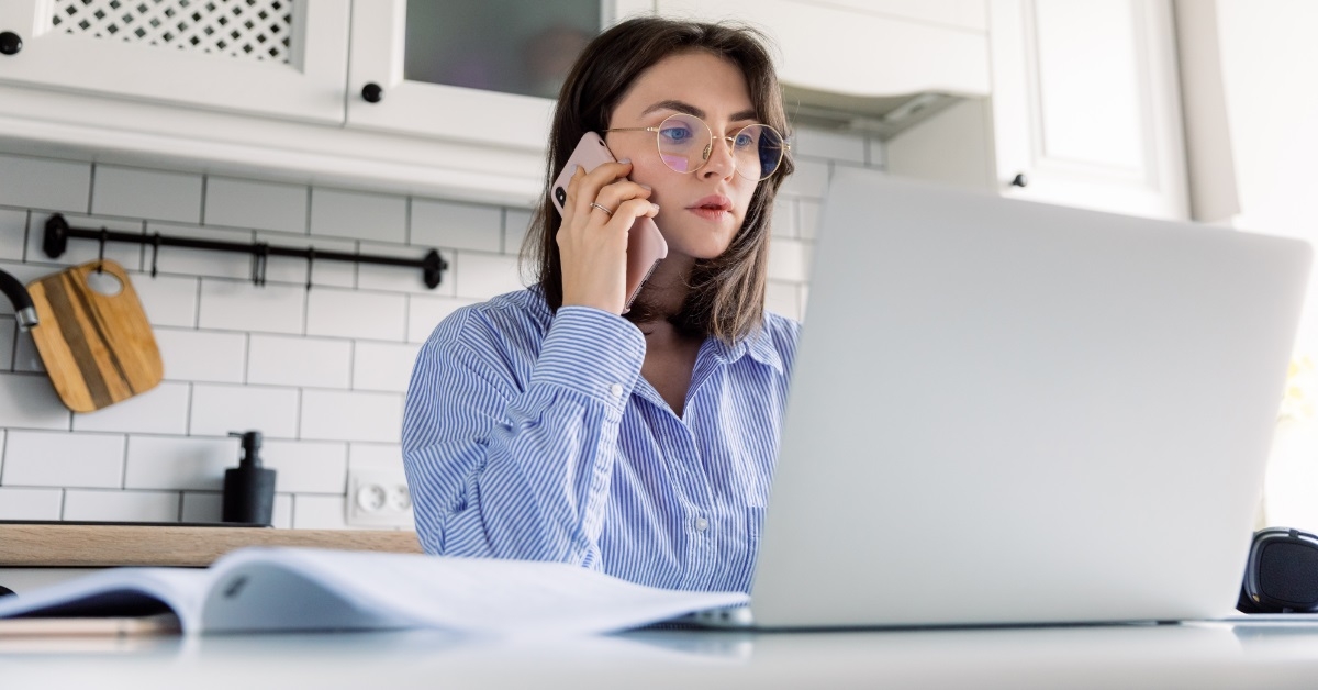 stressed woman on call at home