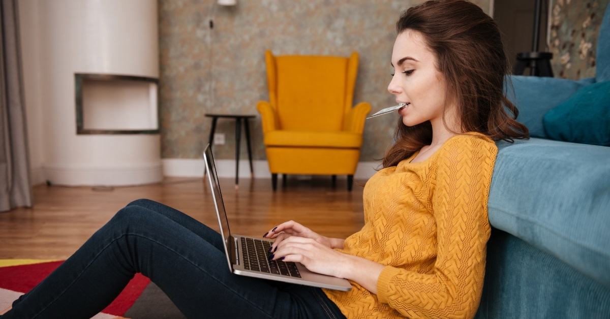 young woman shopping online using laptop