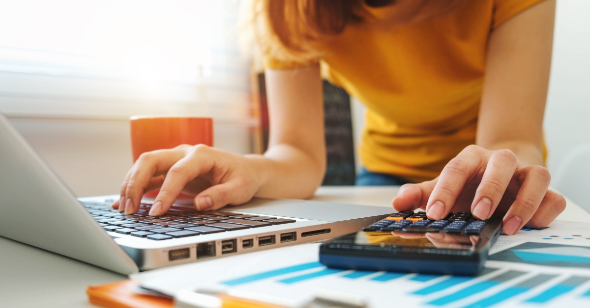 calculator and laptop with tablet