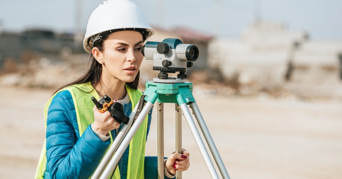 female surveyor using radio set outdoors
