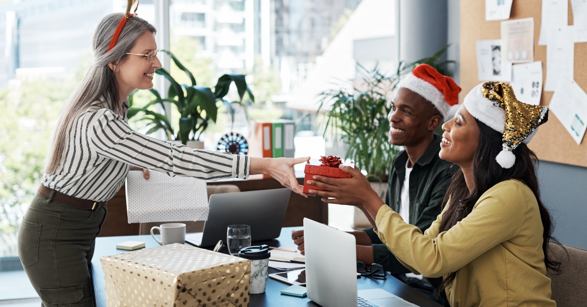 group of businesspeople exchanging gifts