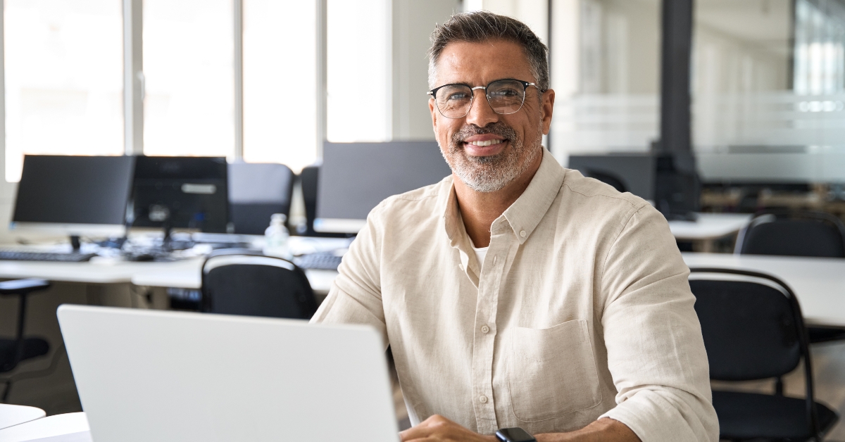 trader using laptop computer