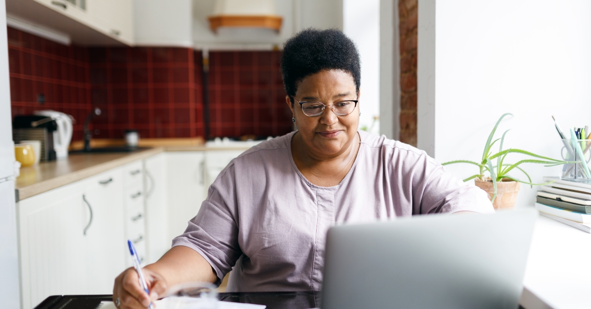 woman sitting in front of laptop