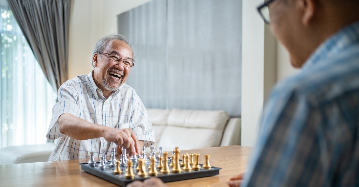 male friends playing chess