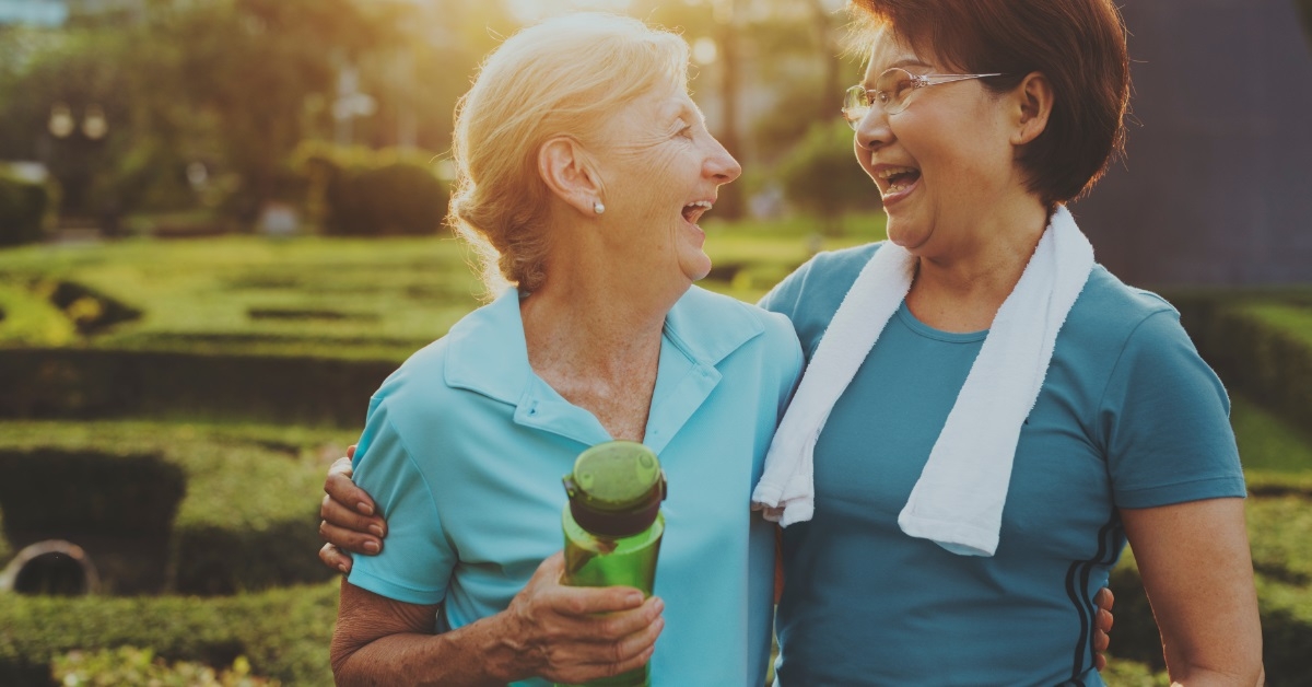 happy senior women working out outdoors