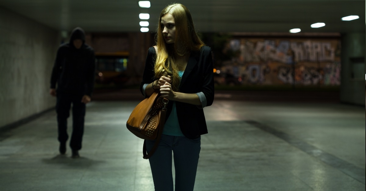 lonely woman scared while passing underpass