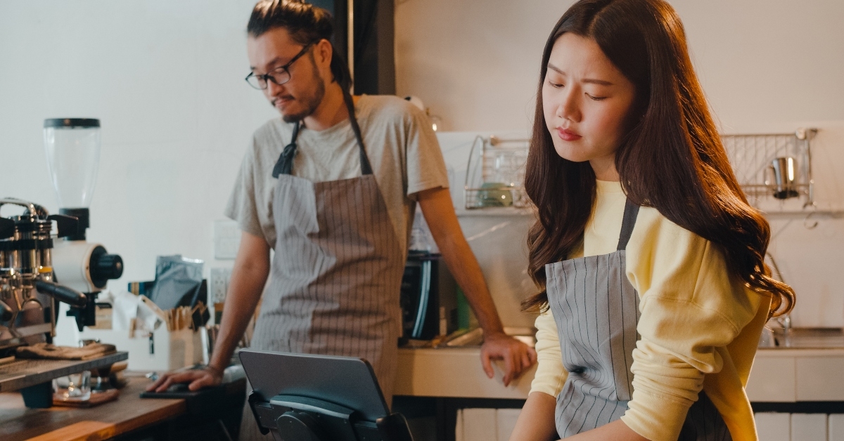 female and male barista