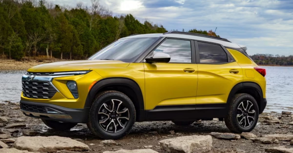 yellow chevy trailblazer on beach
