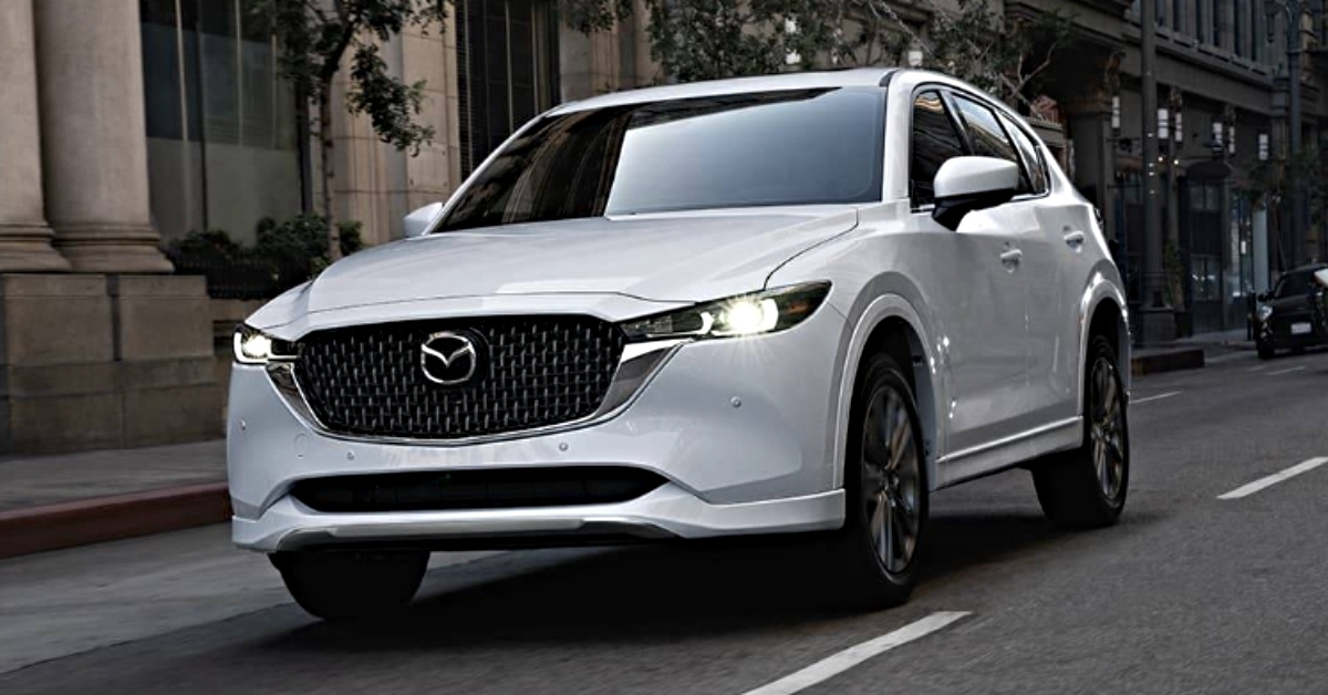 white mazda cx-5 driving on road
