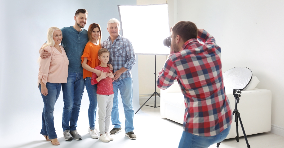 photographer taking photo of family
