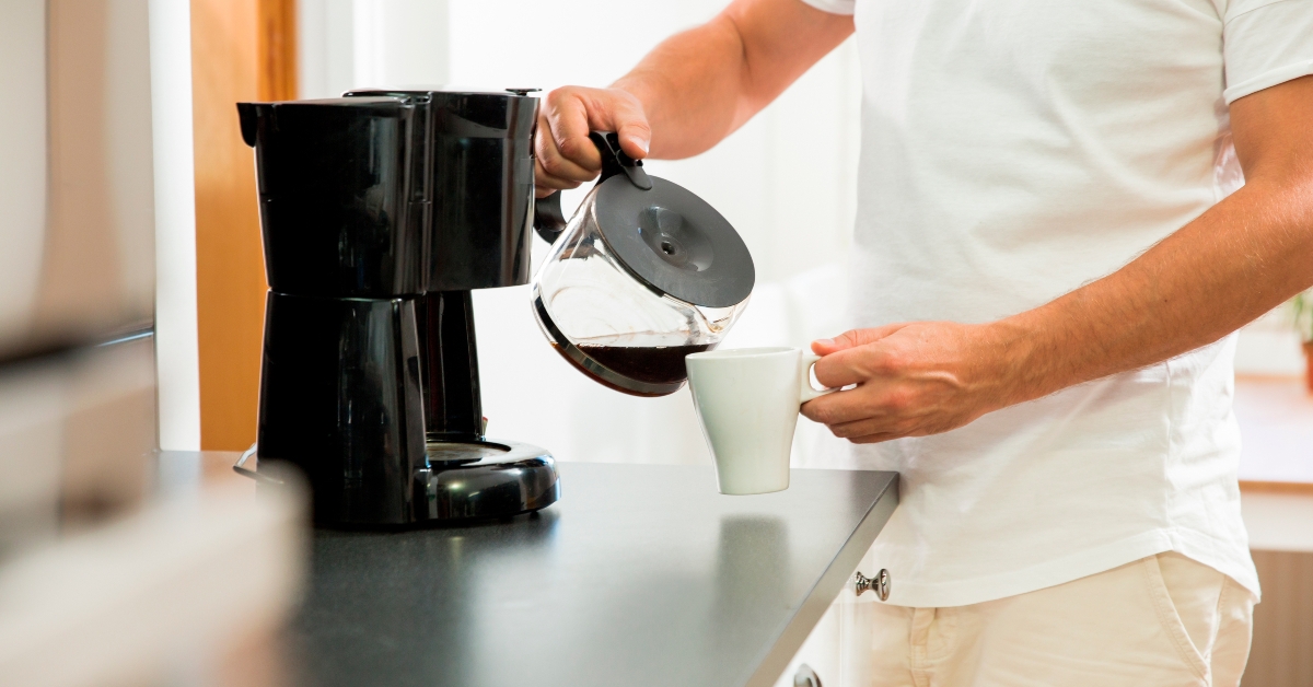 pouring a mug of hot filtered coffee