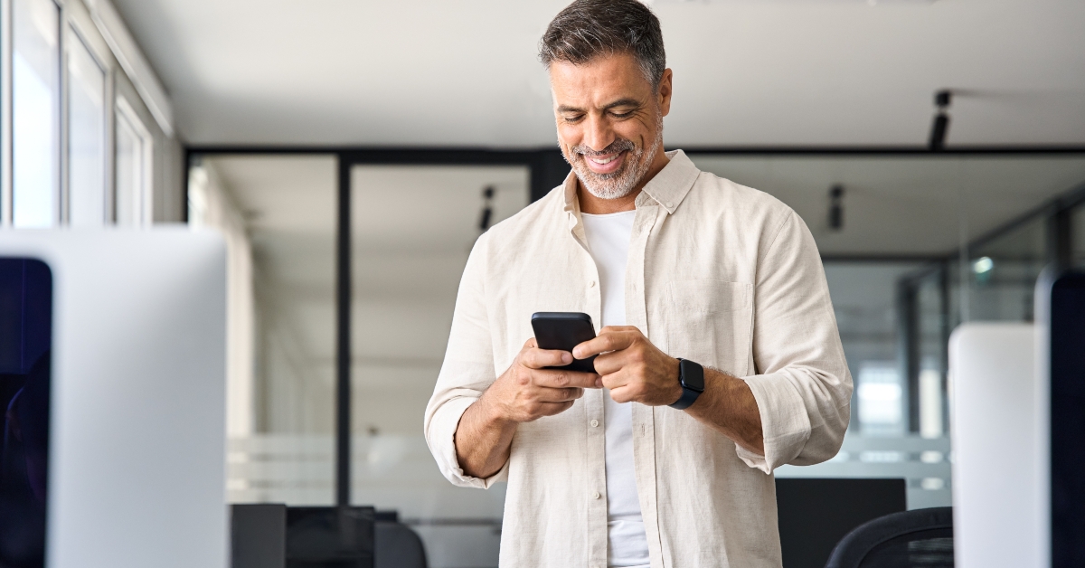 businessman holding smartphone