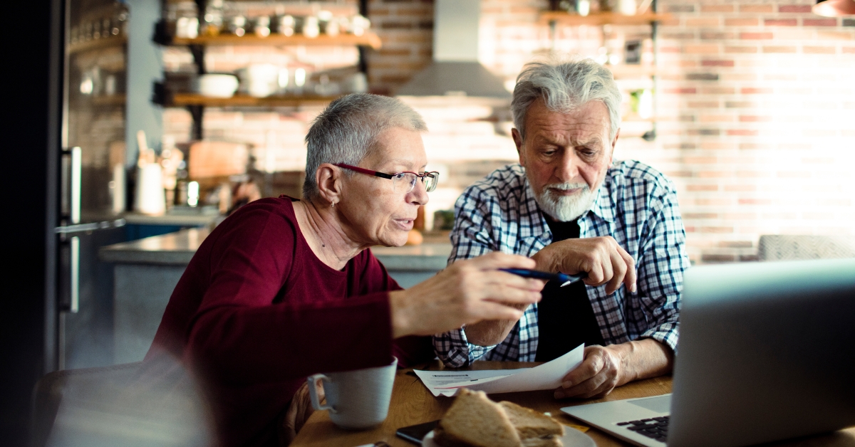 senior couple doing bills