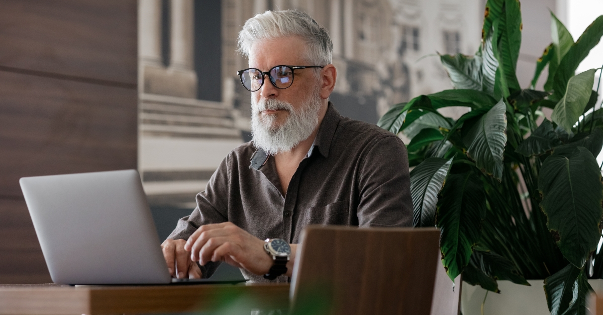 senior working with a laptop