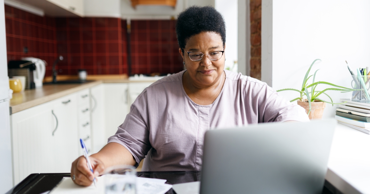 woman sitting in front of laptop