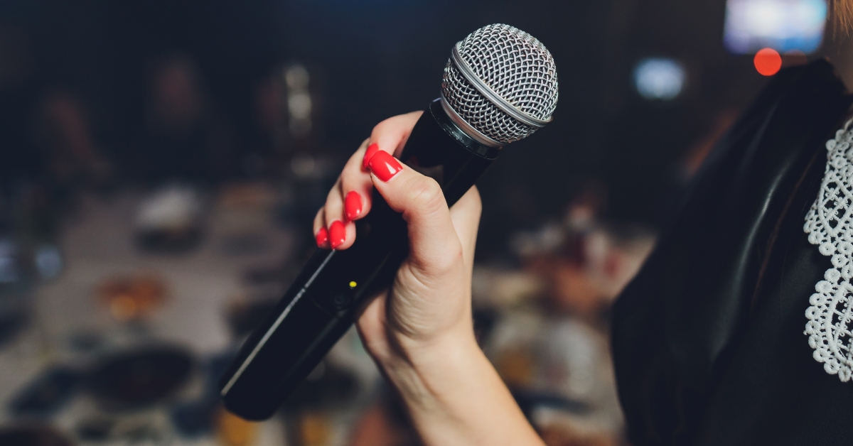 female singer holding microphone