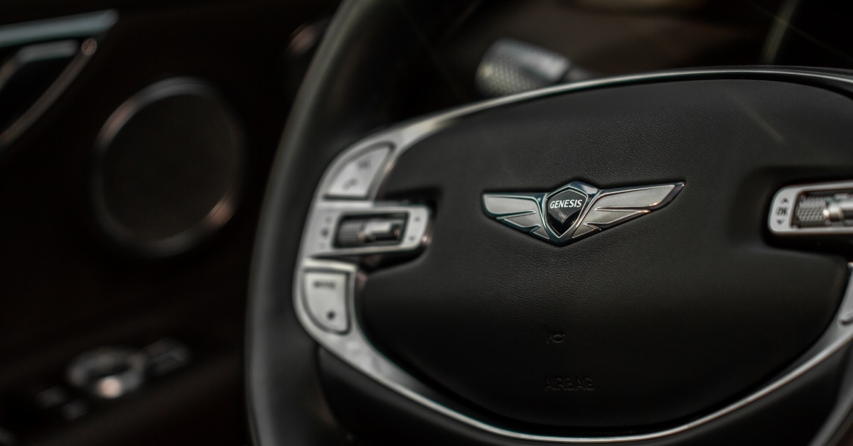 genesis logo on car steering wheel