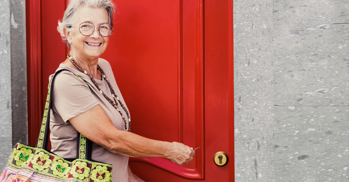 senior woman opening the house