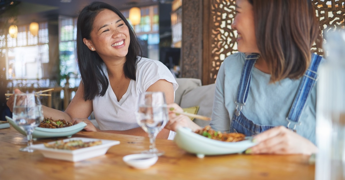 asian girl friends enjoying lunch