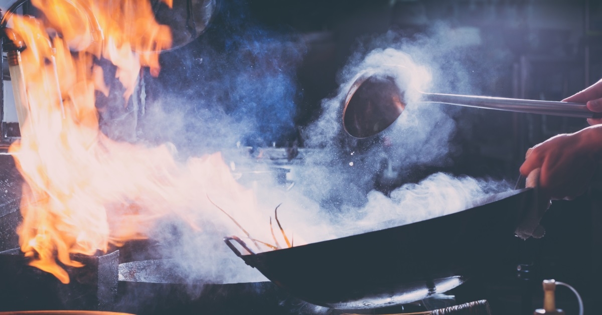 chef preparing stir fry dish