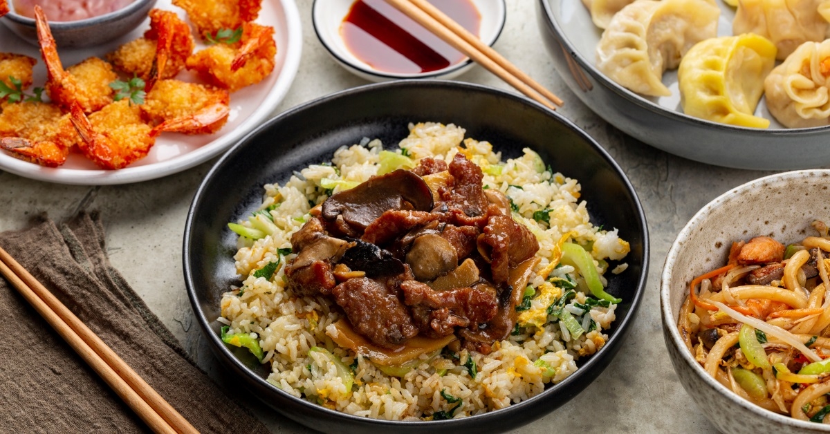 chinese dishes on table with chopsticks