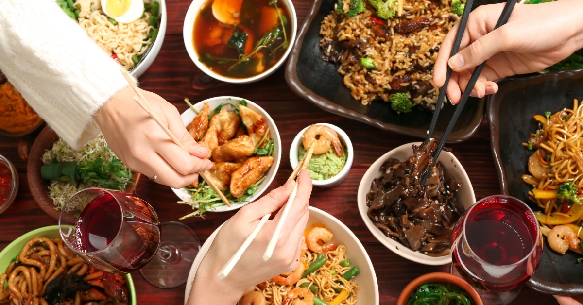 friends having delicious chinese dishes