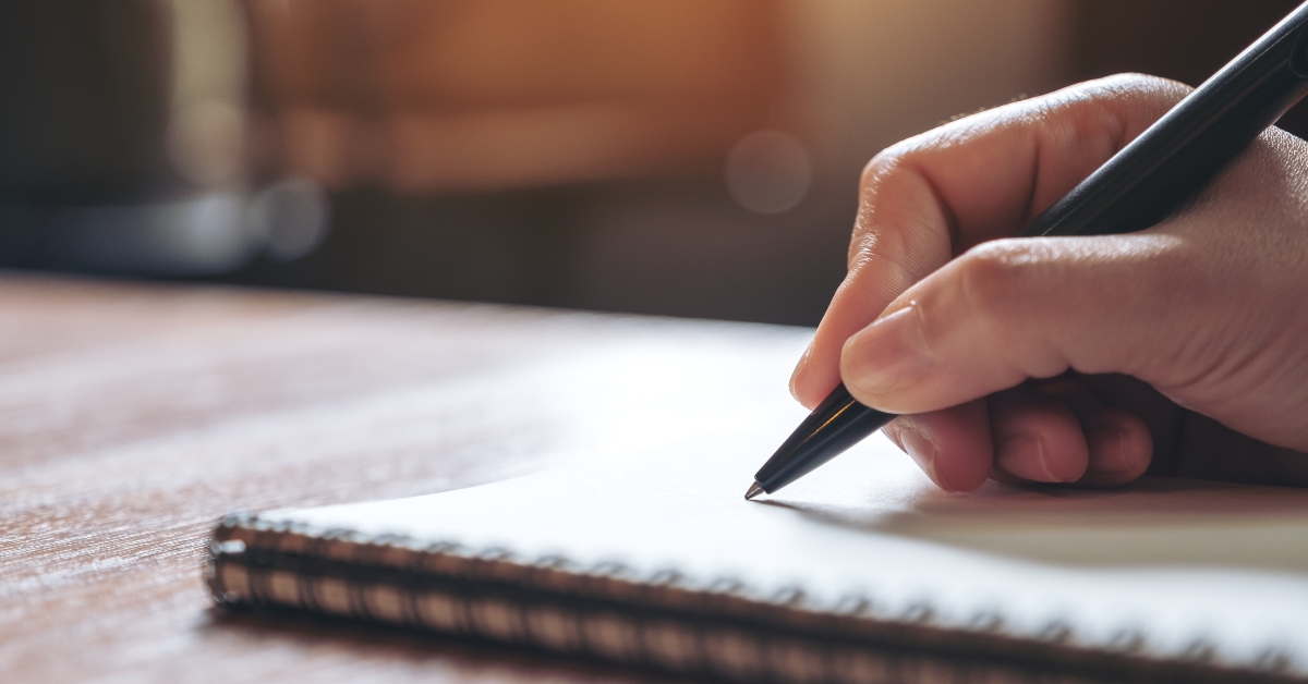 hand writing on a notebook