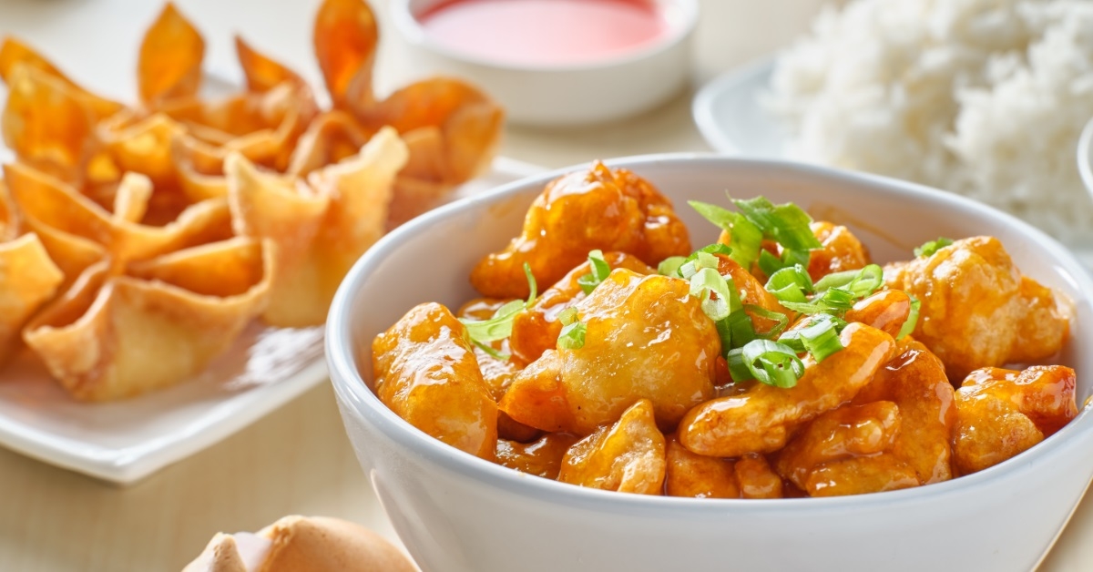 orange chicken bowl with fortune cookies