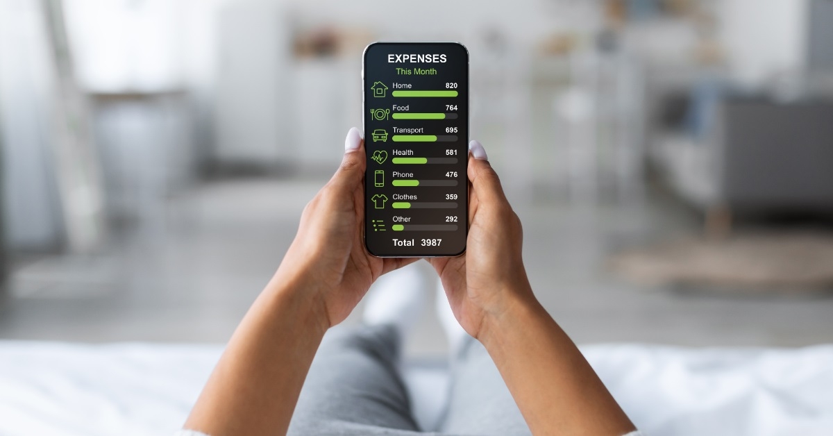 woman reviewing monthly expenses on smartphone