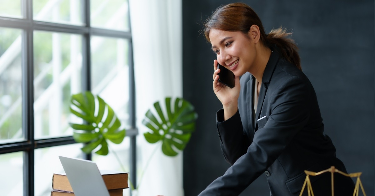 female Lawyer using laptop in office