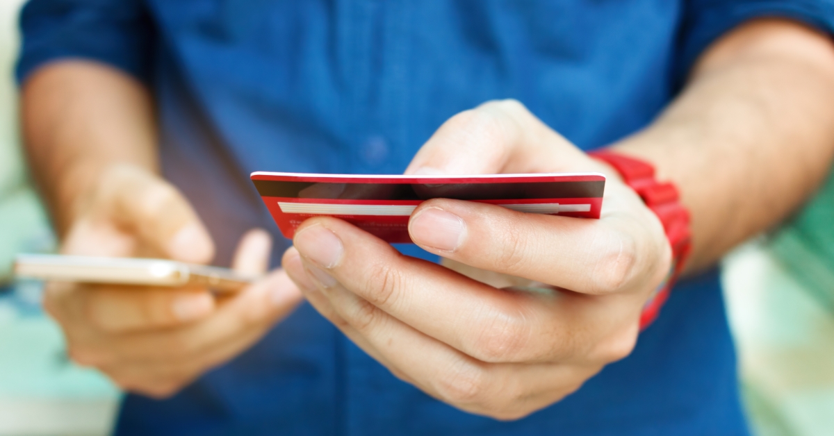 man holding credit card