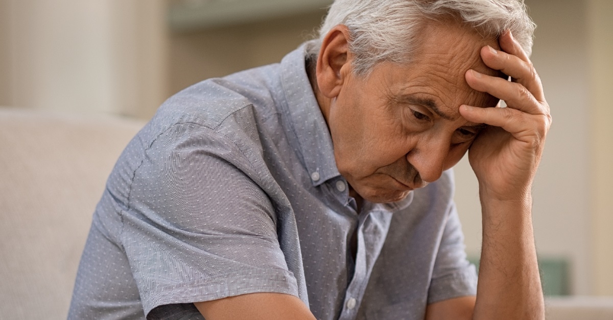 senior man lost in thoughts
