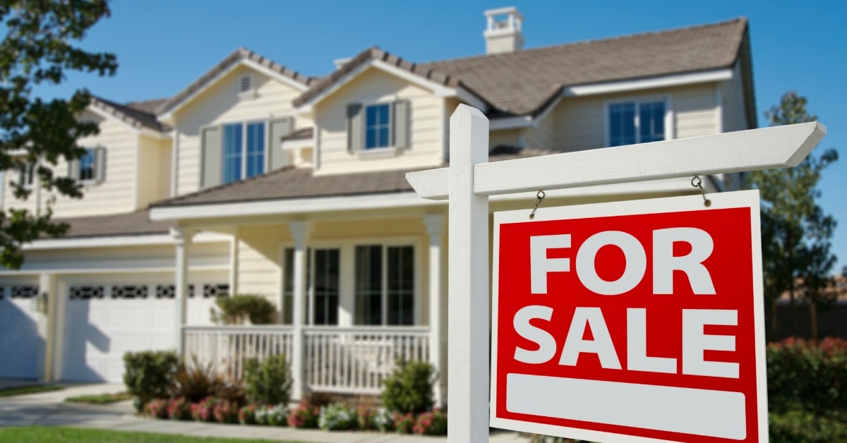 for sale sign outside new house