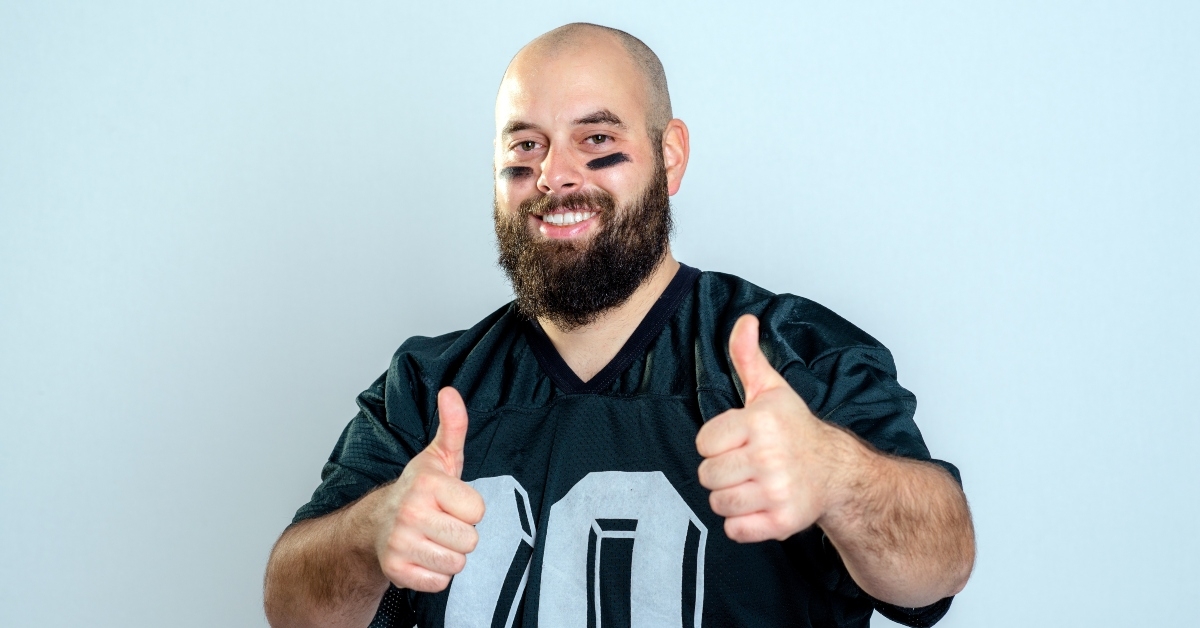 football player with thumbs up