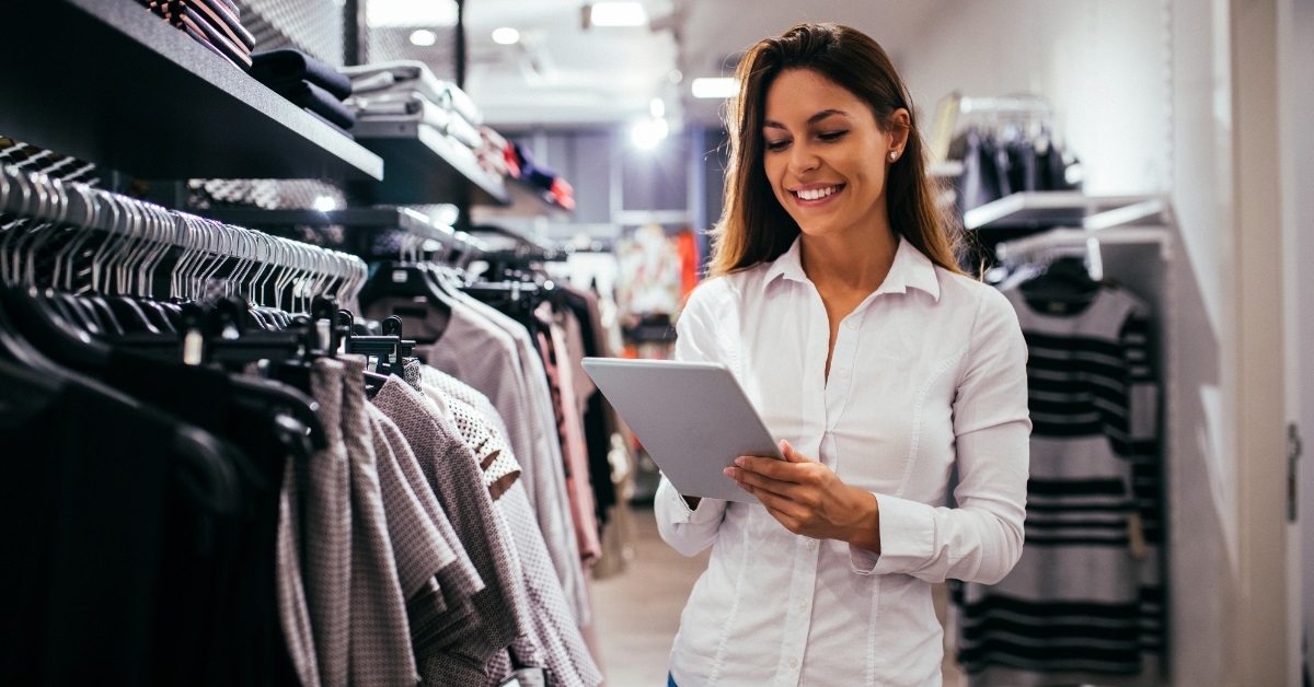 sales woman checking inventory on tablet