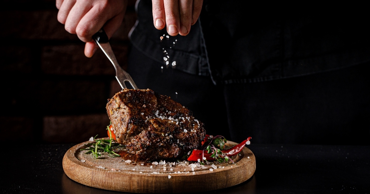 salt on the cooked steak