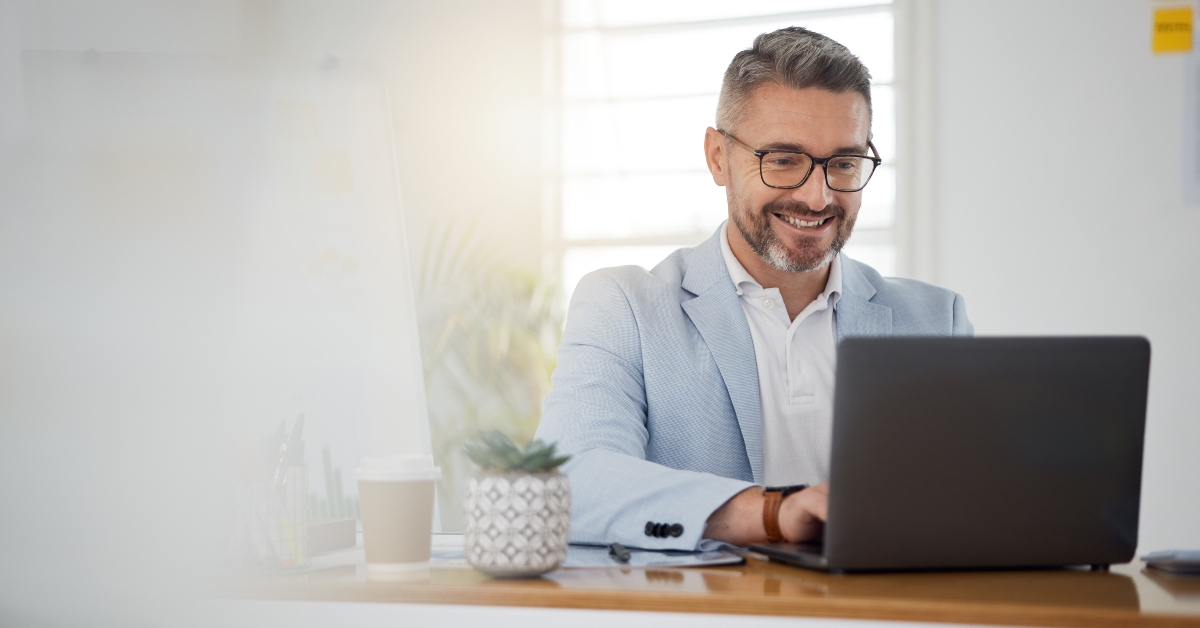 businessman typing on laptop