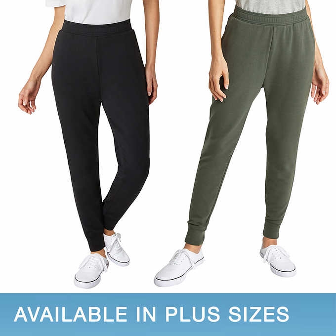 Black and green joggers women wearing white shoes