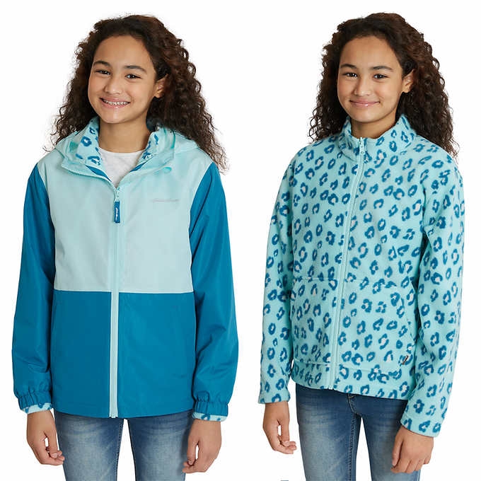 Twins wearing similar blue clothes