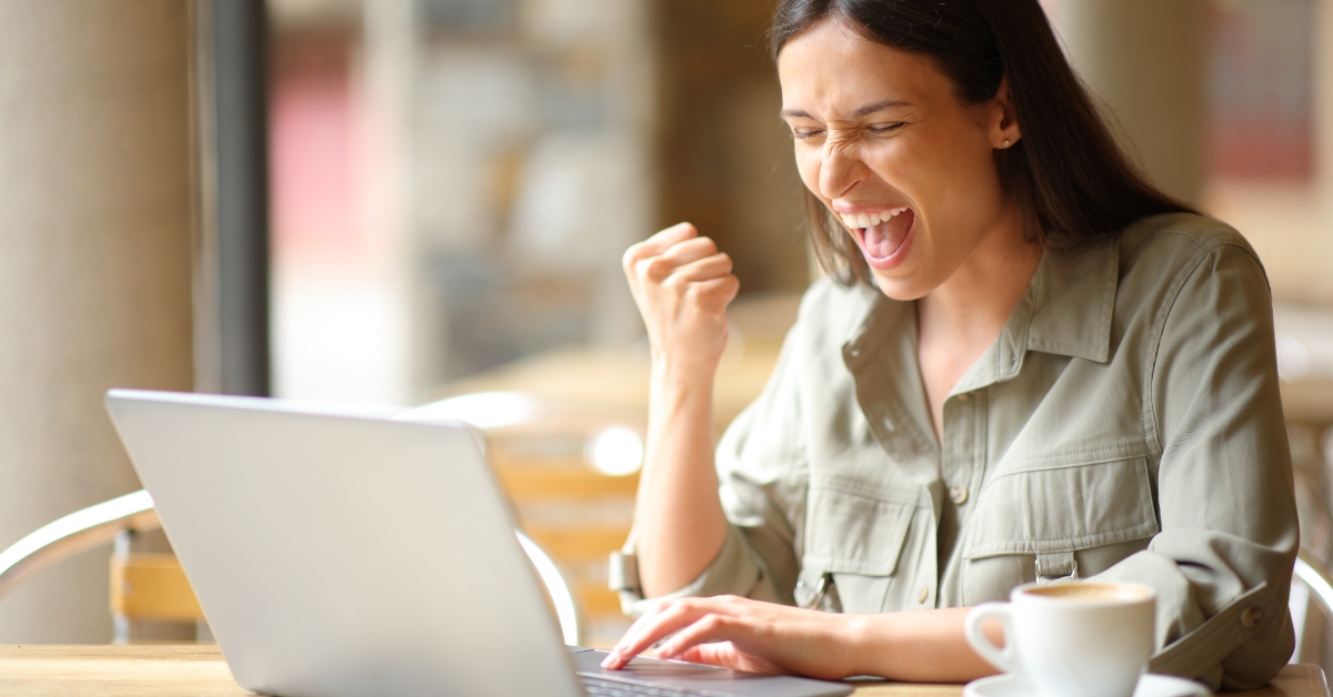 excited woman celebrating in a restaurant