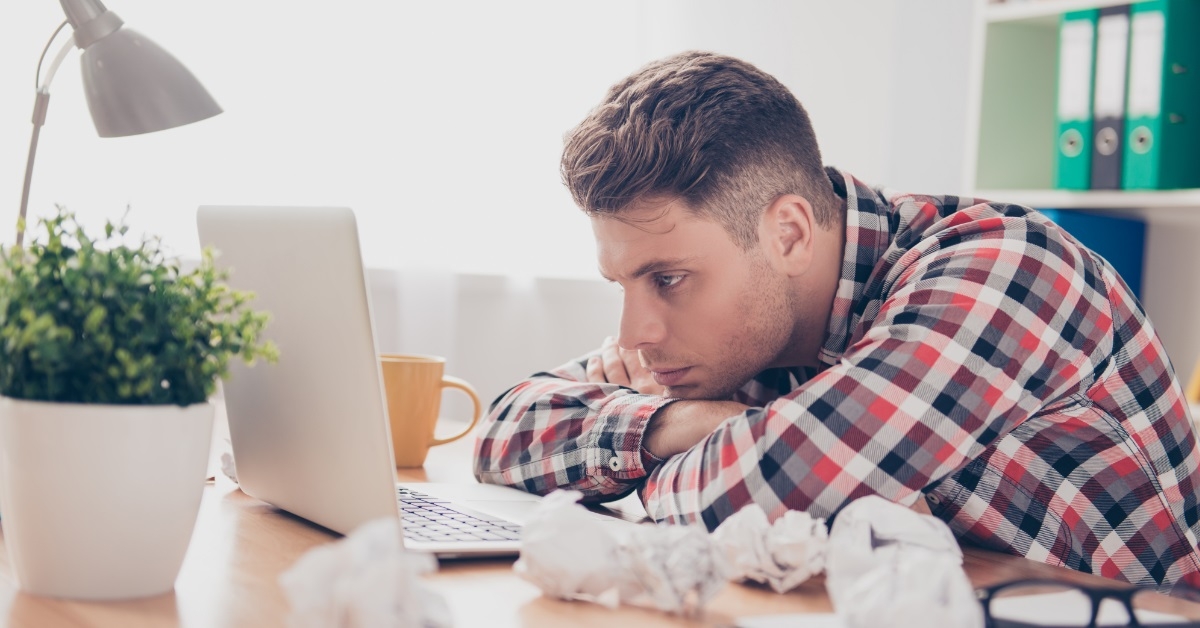 frustrated man giving up at work
